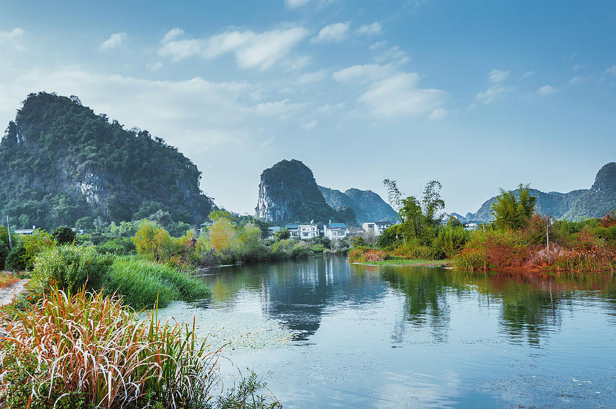 The karst mountains and river scenery #12 Photograph by Carl Ning
