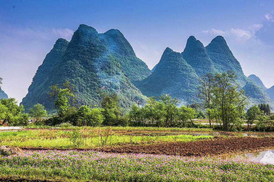 Karst mountains and rural scenery #13 Photograph by Carl Ning
