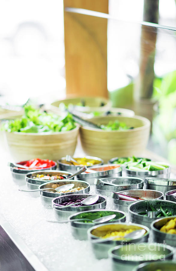 Bowls Of Mixed Fresh Organic Vegetables In Salad Bar Display