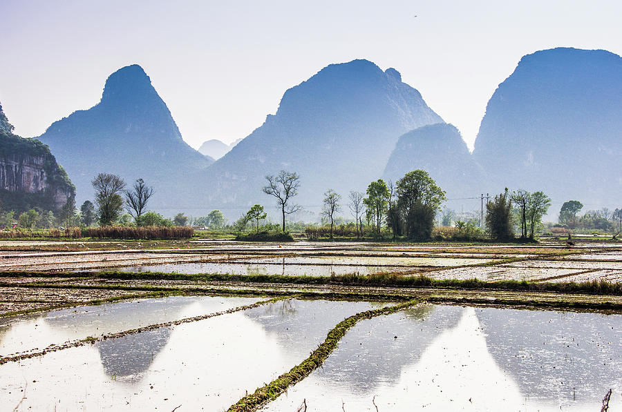 Karst mountains and rural scenery #15 Photograph by Carl Ning