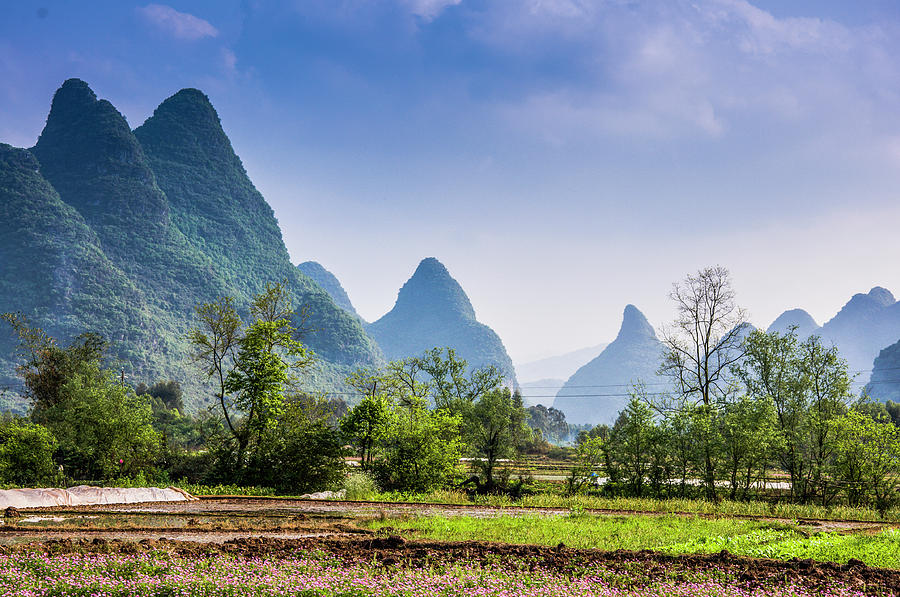 Karst mountains and rural scenery #16 Photograph by Carl Ning
