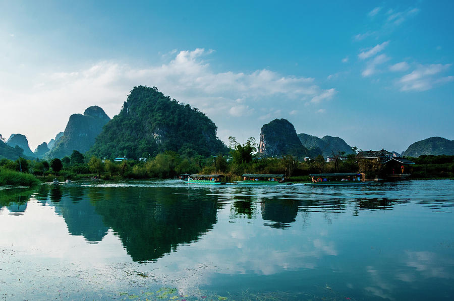 The karst mountains and river scenery #16 Photograph by Carl Ning ...