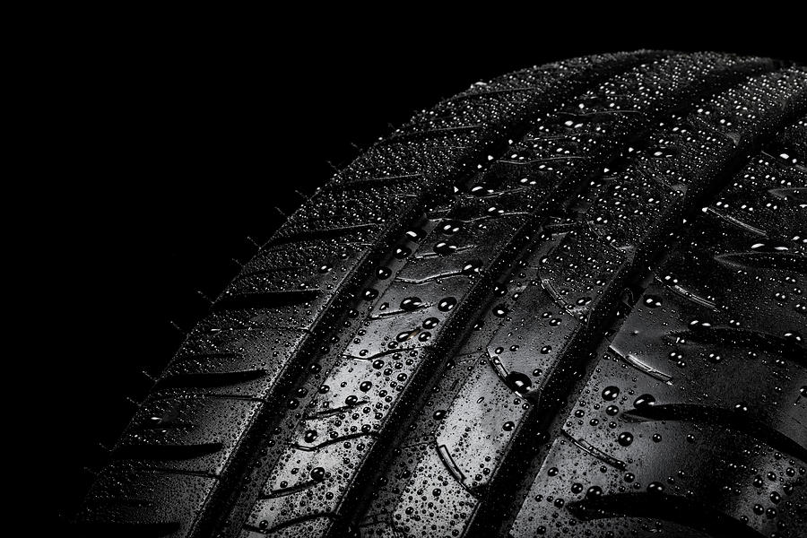 Car Tyre Isolated On A Black Background Photograph by Ben Gingell