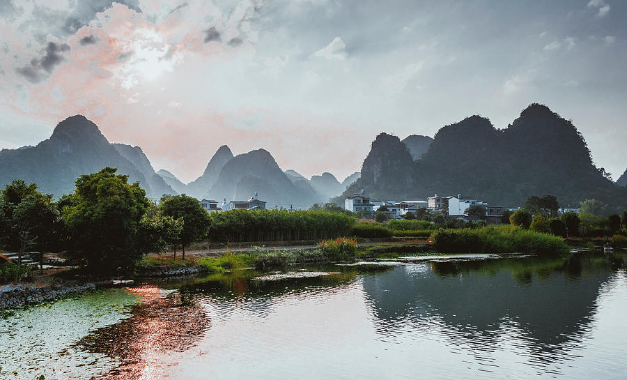 The karst mountains and river scenery #17 Photograph by Carl Ning