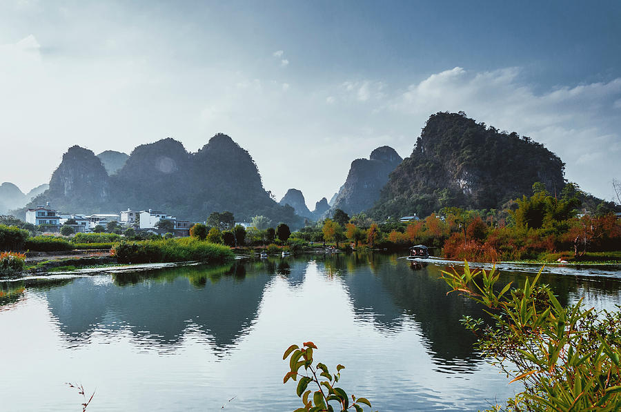 The karst mountains and river scenery #18 Photograph by Carl Ning