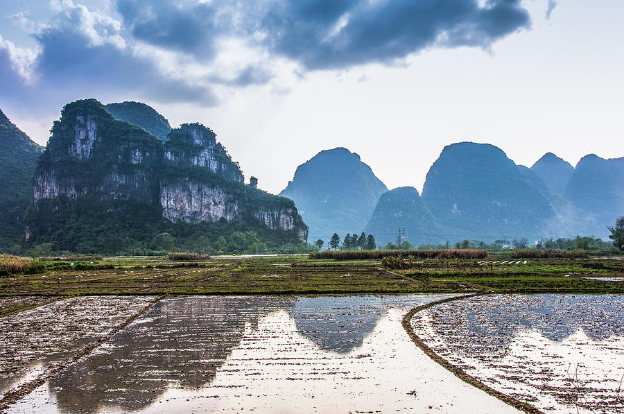 Karst mountains and rural scenery #19 Photograph by Carl Ning
