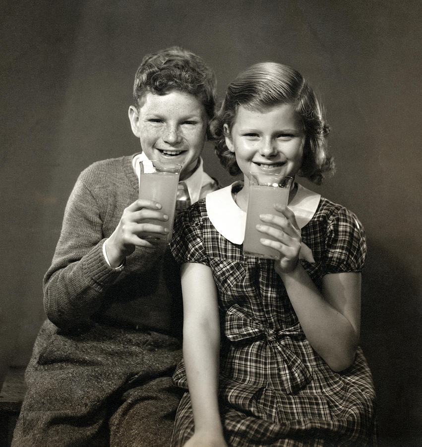1940 Children enjoying Orange Juice Photograph by Historic Image