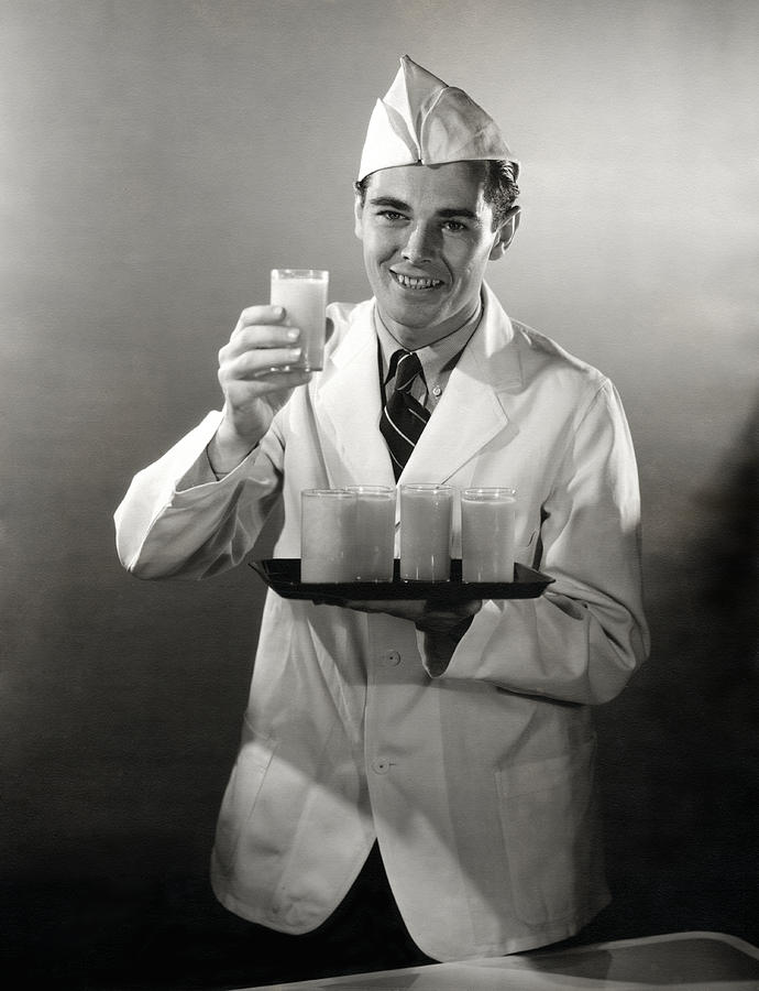 1940 Soda Jerk Serving Drinks Photograph by Historic Image