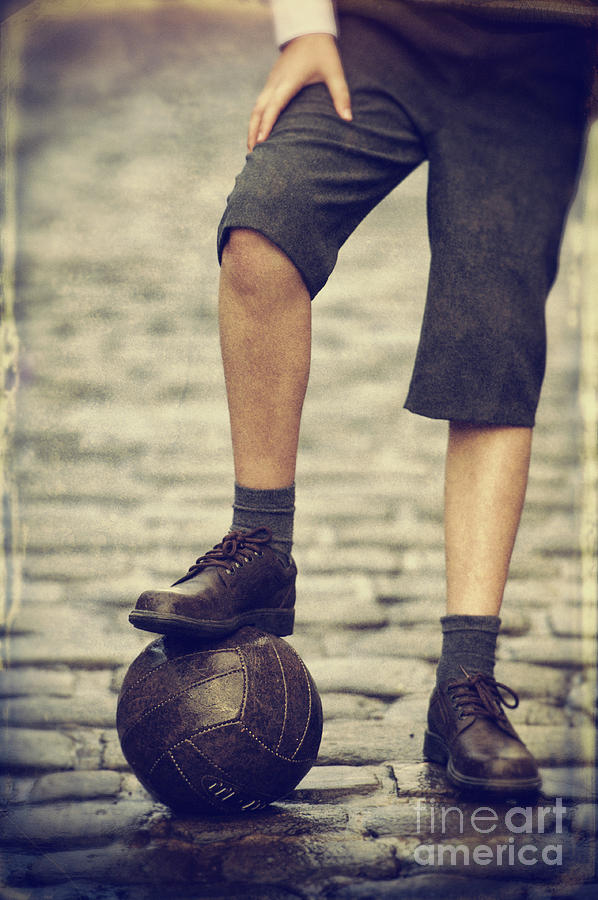1940s Boy With A Vintage Leather Football On A Cobbled Street Photograph by Lee Avison