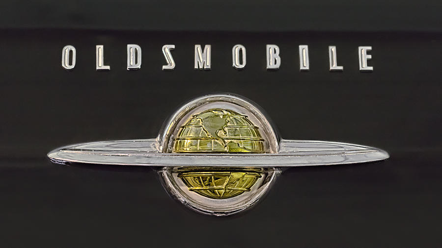1950 Oldsmobile Ringed Globe Emblem Photograph by Susan Rissi Tregoning