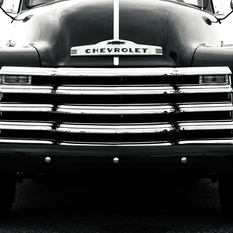 Black And White Photograph - 1950s Chevy Work Truck Grille Detail by Jon Woodhams