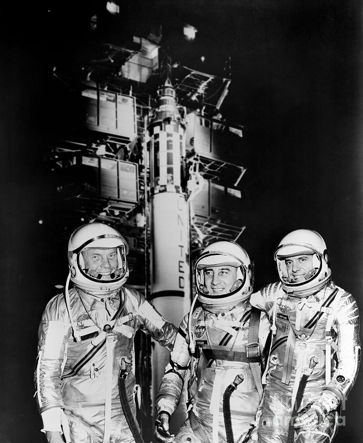 1961 Mercury astronauts John H Glenn Jr Virgil Grissom and Alan B Shepard Jr standing by Rocket Photograph by Vintage Collectables