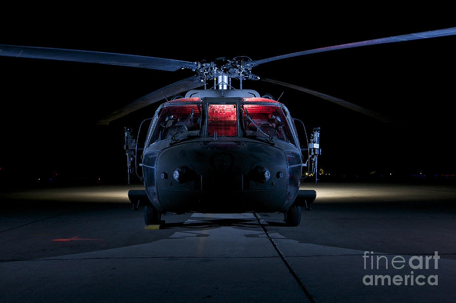 Transportation Photograph - A Uh-60 Black Hawk Helicopter Lit #2 by Terry Moore