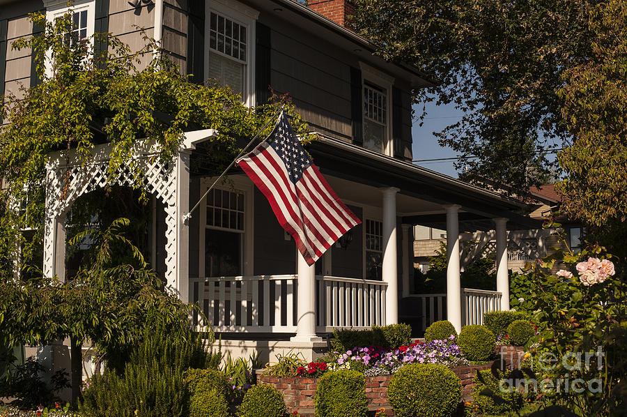 American Flag on porch #2 Photograph by Jim Corwin