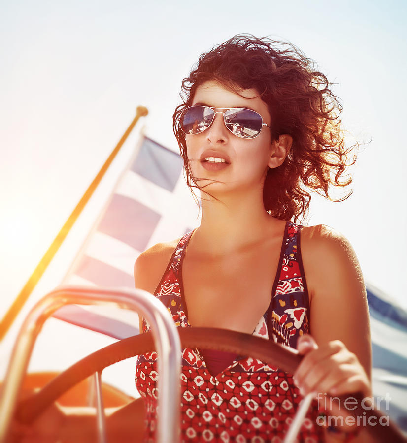Beautiful woman driving sailboat #2 Photograph by Anna Om