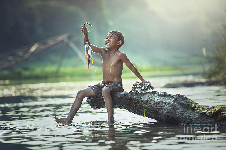 Boy fishing at the river #2 by Sasin Tipchai