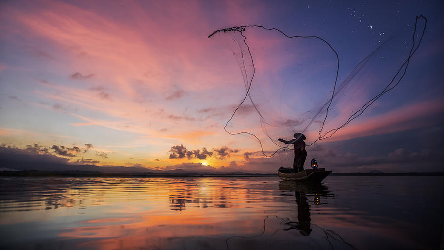 Fisherman of Bangpra Lake Photograph by Anek Suwannaphoom | Fine Art ...