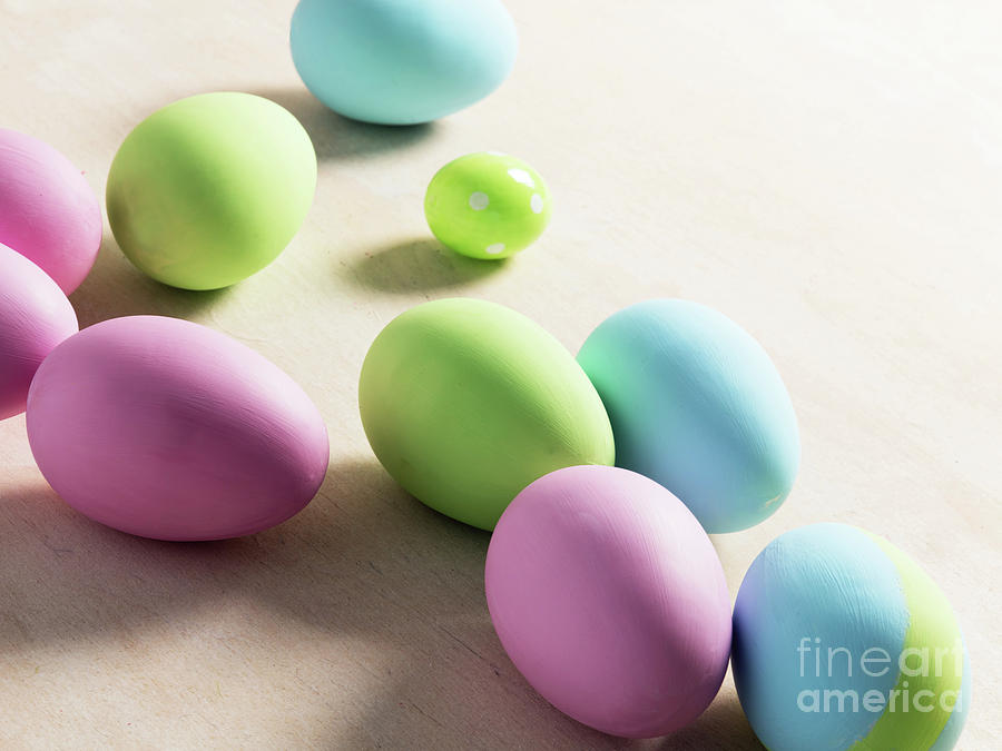 Pastel Easter eggs on wooden table. #2 Photograph by Michal Bednarek