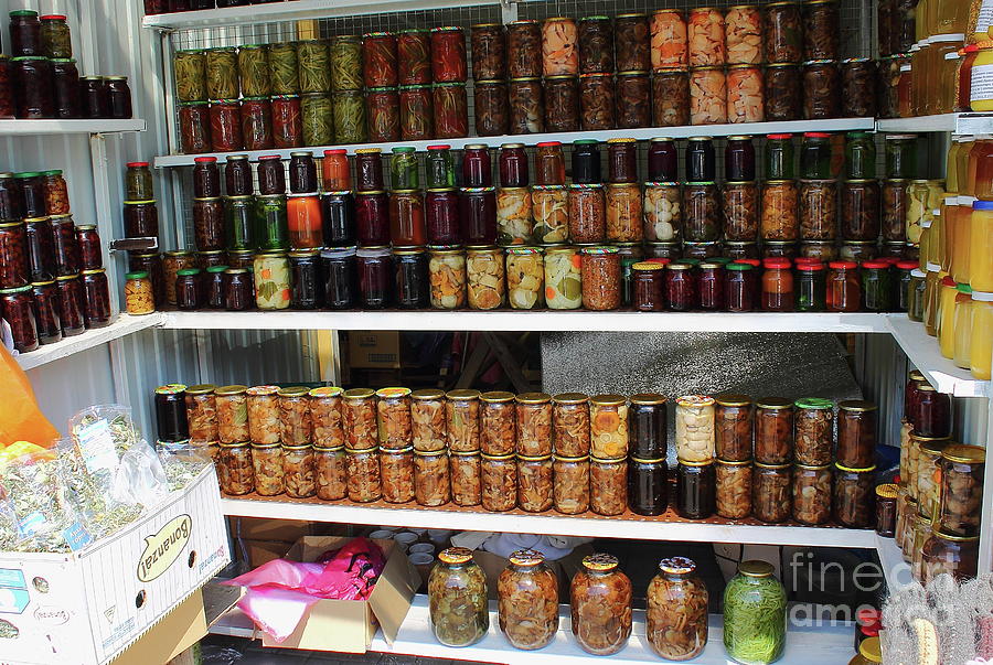 Preserved Food In Glass Jars On Wooden Shelf. Various Pickled Foods Are Sold. Photograph