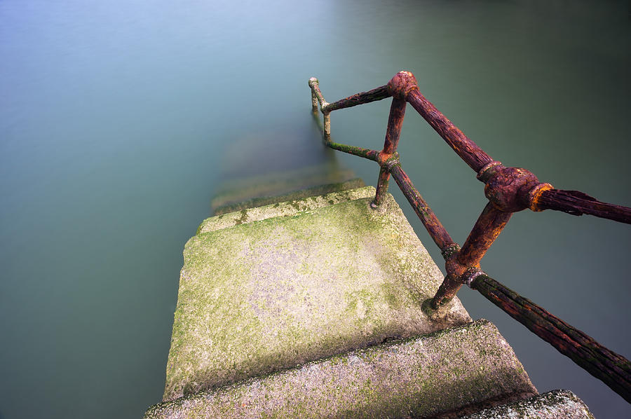 Rusty Handrail Going Down On Water #2 Photograph by Mikel Martinez de Osaba
