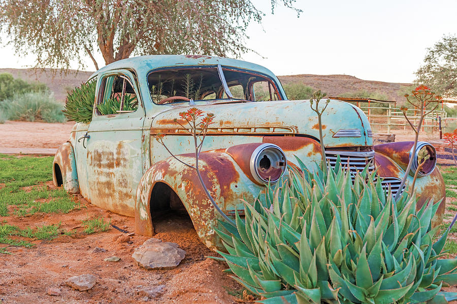 Rusty vintage car in Namibia #2 Photograph by Marek Poplawski