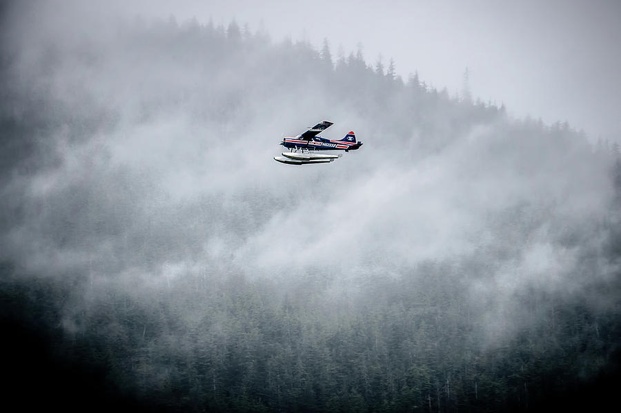 Single Prop Airplane Pontoon Plane flying through fog over Alask #2 Photograph by Alex Grichenko