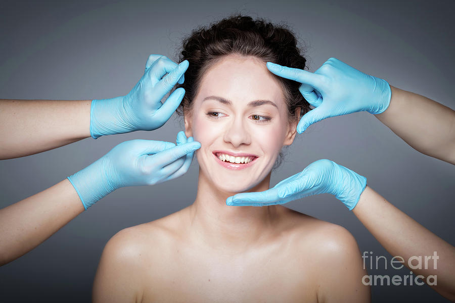 Smiling woman having skin checkup before plastic surgery. #2 Photograph by Michal Bednarek