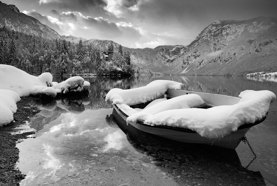 Snow covered boat on Lake Bohinj in Winter #2 Photograph by Ian Middleton