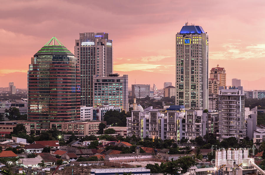 Stunning susnset over Jakarta business district in Indonesia cap #2 Photograph by Didier Marti