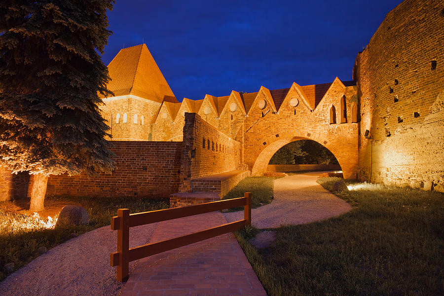 Teutonic Knights Castle at Night in Torun #2 Photograph by Artur Bogacki