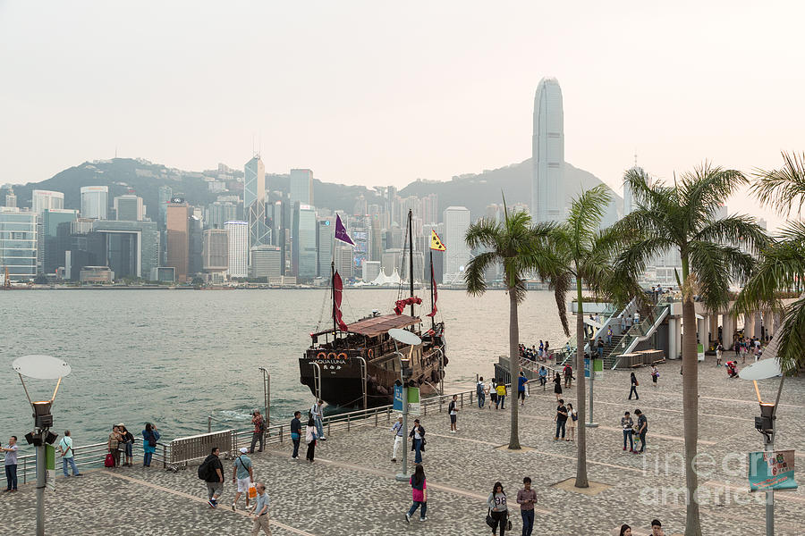 Tourists in Hong Kong waterfront promenade #2 Photograph by Didier Marti