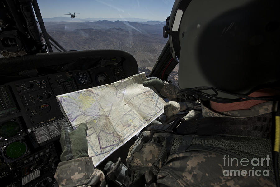 Uh-60 Black Hawk Pilot Reading A Map #2 Photograph by Terry Moore