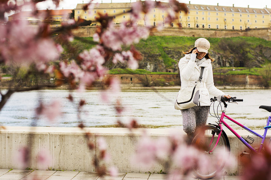Bicycle Photograph - Woman with hat talking on the phone in spring #2 by Newnow Photography By Vera Cepic