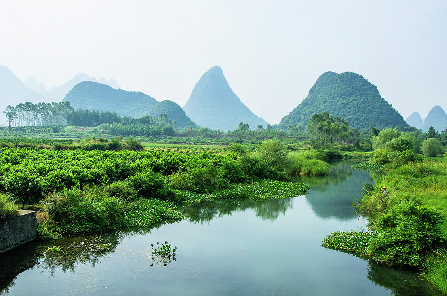 Karst mountains and rural scenery #20 Photograph by Carl Ning