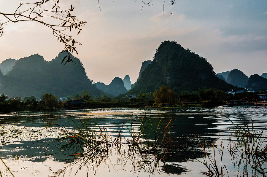 The karst mountains and river scenery #22 Photograph by Carl Ning