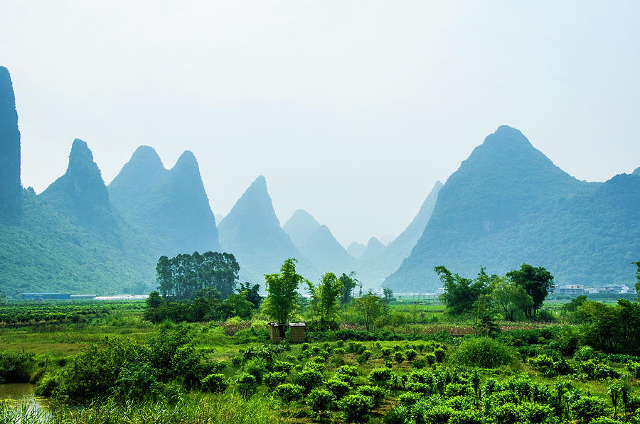Karst mountains and rural scenery #23 Photograph by Carl Ning