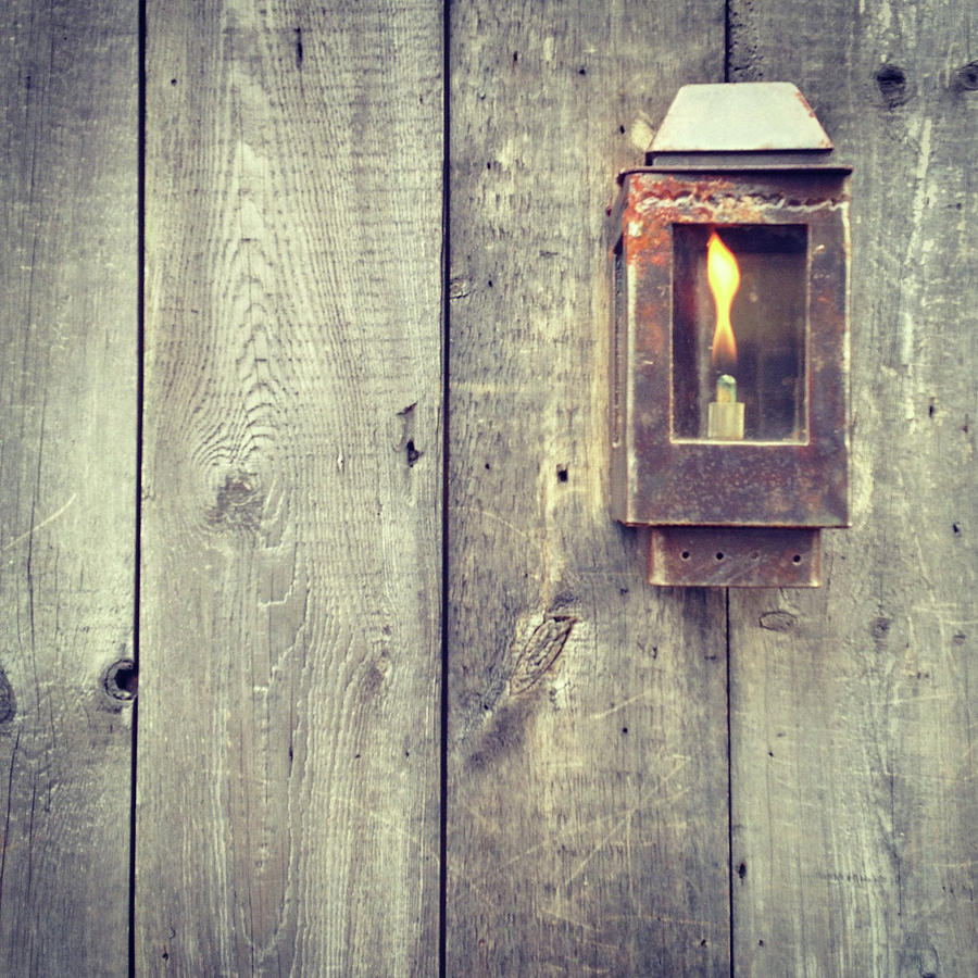 Iron lamp on old wood Photograph by Vintage Pix