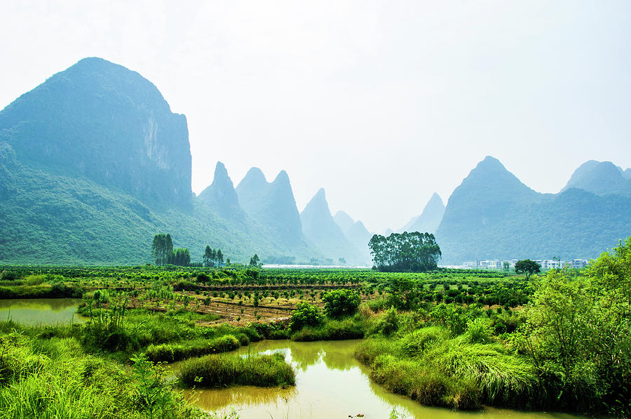 Karst mountains and rural scenery #24 Photograph by Carl Ning