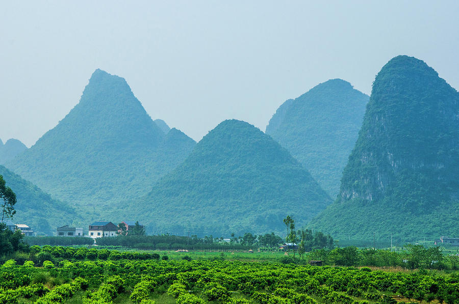 Karst mountains and rural scenery #25 Photograph by Carl Ning