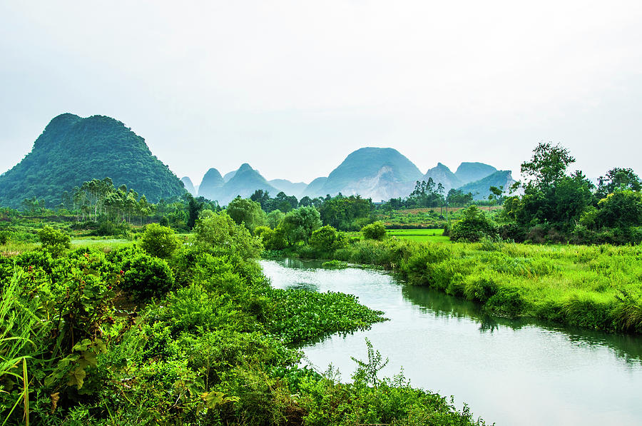 Karst mountains and rural scenery #29 Photograph by Carl Ning