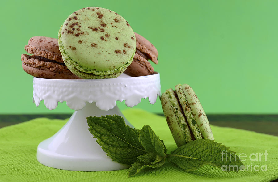 Chocolate and mint flavor macaroons on dark wood table #3 Photograph by Milleflore Images