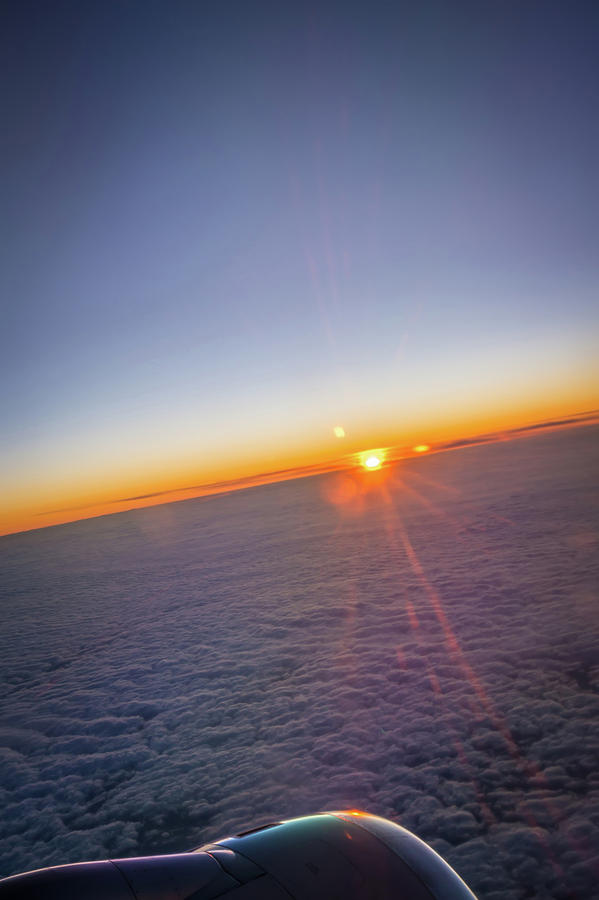 Clouds and sky as seen through window of an aircraft at sunrise #3 Photograph by Alex Grichenko