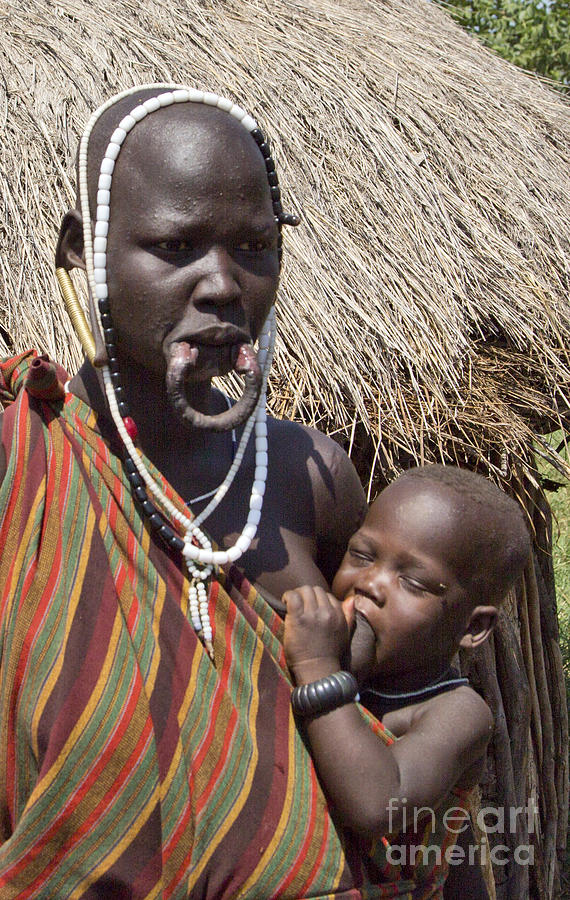 Mursi woman with elongated lower lip Photograph by Eyal Bartov | Fine ...