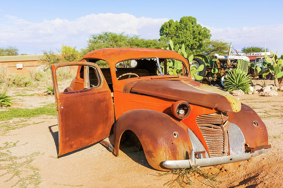 Old and rusty vintage car in Namibia #3 Photograph by Marek Poplawski