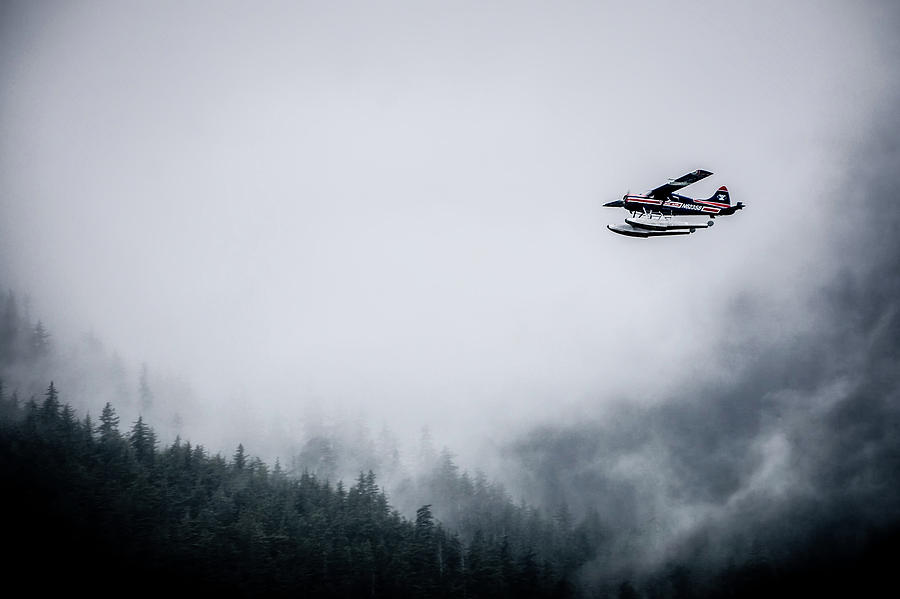 Single Prop Airplane Pontoon Plane flying through fog over Alask #3 Photograph by Alex Grichenko