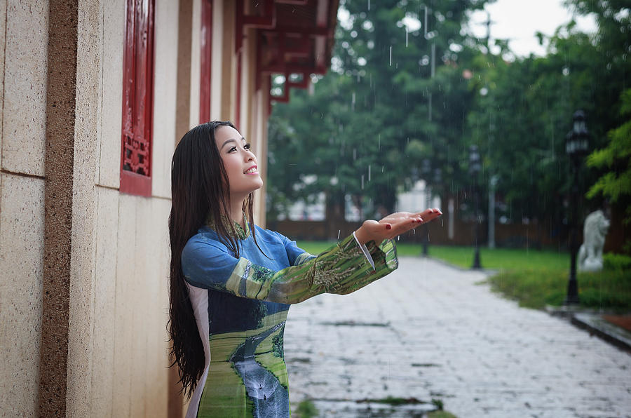 Vietnamese women wear Ao in the rain. Ao dai is famous traditional custume  for woman in Vietnam. #5 Photograph by Huynh Thu - Pixels