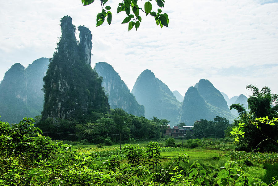 Karst mountains and  rural scenery #30 Photograph by Carl Ning
