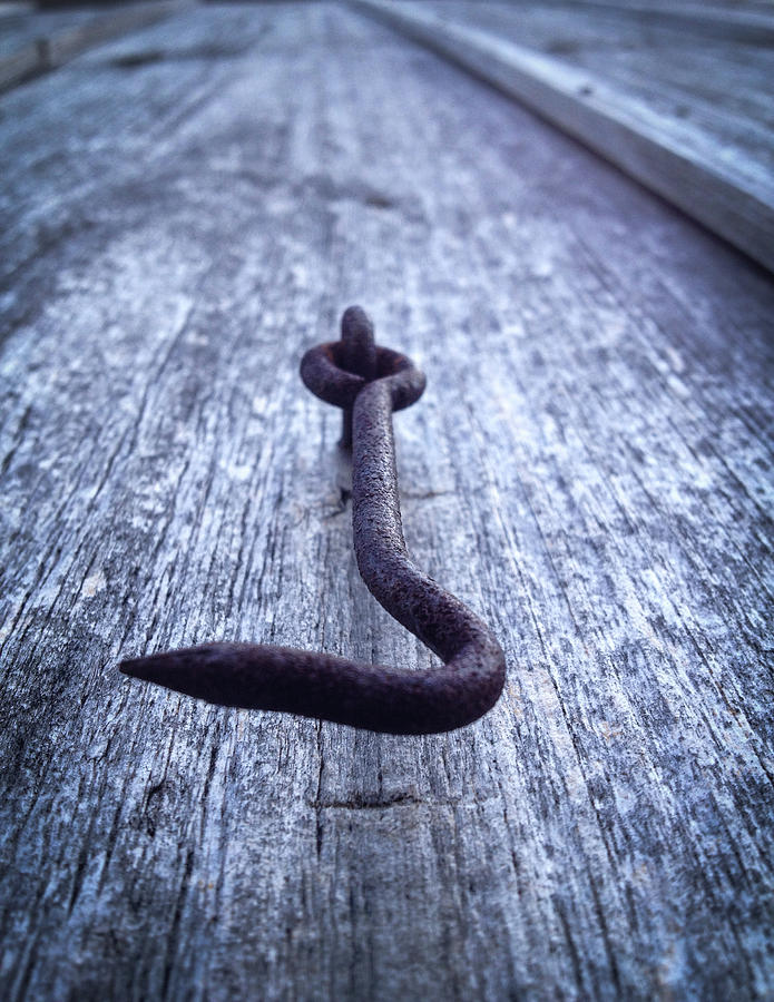 Iron hook on old wood Photograph by Vintage Pix