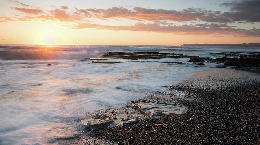 Beautiful dramatic Sunset over a rocky coast Photograph by Michalakis Ppalis