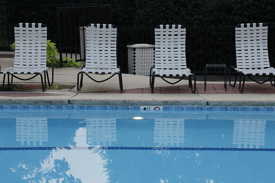 4 white Chairs at Poolside Photograph by Valerie Collins
